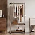 Metal Clothes Rack Hanging Shirts Coats With Lower Shelf Holding Bag And Bottles Near Cabinet