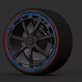 Modern Car Tire With Black Alloy Wheel And Red Blue Accent Design