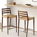 Two Modern Wooden Bar Stools With Woven Beige Seats By Wooden Bar Counter