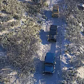 Stunning Snow Covered Winter Forest Scenery With Three Off Road Cars Parked On Narrow Trail