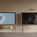 Pollform Televisions on Stands with One Blue Interface Screen and Another Black Display in Interior