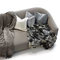Plush Double Sofa Featuring Gray Pillows Soft Blanket And Faux Fur Throw