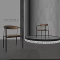 Leisure Chair With Curved Backrest Armrests Upholstered Seat Black Metal Legs Gray Wall Dark Floor