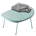Light Green Padded Stool With Metal Legs And Gray Cloth Placed On Seat