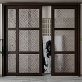 Sliding Doors with Wooden Frame and Patterned Glass in Interior Space Flanked by Green Plants