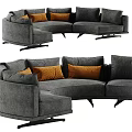 Modern Curved Sectional Sofa With Gray Upholstery And Orange Cushions