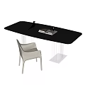 Modern Black Desk With Glass Top Metal Frame Light Colored Chair Books And Decorative Bird