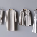 Light Clothes Hanging On Gray Background Featuring Loungewear Cardigan Shirt Jacket And Polka Dot Dress