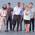 Group of Diverse People Standing Together in Various Outfits Against Gray Background