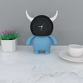 Blue Cartoon Clock Figure With White Horns Purple Flowers And Green Plants