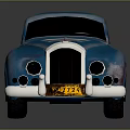 Blue Vintage Classic Car With Emblem Round Headlights And Silver Wheels