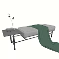 Cozy Footstool With Gray Cushion Green Blanket And Small Table With Vase Plant