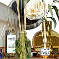 Perfume Cosmetics Collection On Metal Tray With Aromatic Bottles Reed Diffusers Candles And White Rose