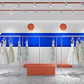 Modern Clothing Store Front With Orange Awning Window Display Mannequins And Displayed Apparel