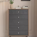 Wooden Chest of Drawers Featuring Dark Blue Drawers Golden Handles And Top Vase Books Clock