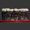 Delicious Chocolate Cake Topped With Whipped Cream Fresh Cherries And Chocolate Shavings On Red Plate