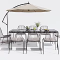 Modern Outdoor Dining Table And Chairs Set With Umbrella Flower Arrangement And Fruits