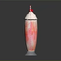 Colorful Layered Milkshake In Tall Glass Topped With Whipped Cream Cherry And Striped Straw