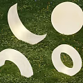 White Outdoor Lights In Various Shapes Placed On Green Grass For Decoration