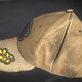 Vintage Brown Cotton Hat with Circular Badge and Yellow Leaf Patch