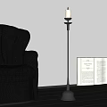 Elegant Candle Lamp Beside Black Leather Sofa and Open Book in Interior