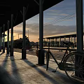Covered Parking Lot With Bicycle Parked During Sunset And Well Lit Spacious Paved Area