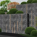 Natural Textured Stone Wall Landscaped With Trimmed Bushes And Green Trees