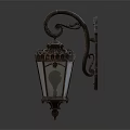 Vintage Ornate Wall Light With Curved Metal Frame And Glass Shade