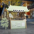 Traditional Style Market Kiosk With Green Roof And Bamboo Decoration In Mall Interior