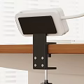 Sturdy Black Metal Shelf Bracket Supporting Electronic Device On Wooden Tabletop