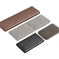 Different Colored Rectangular Cushion Pads In Brown Gray And Black Shades