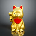 Golden Lucky Cat Figurine With Red Ears Collar And Bell On Shiny Black Surface