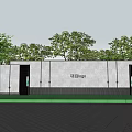 Modern Outdoor Landscape Wall With Project Logo Green Trees Trimmed Shrubs And Paved Plaza
