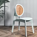 Light Blue Leisure Chair With Orange Woven Backrest Green Plant And Striped Wall Wooden Floor