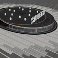 Illuminated Circular Water Fountain With Surrounding Trees And Paved Plaza Ground