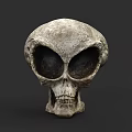 Alien Skull Sculpture With Large Eye Sockets And Weathered Ancient Texture