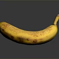 Ripe Yellow Banana With Brown Spots On Dark Reflective Surface