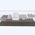 Shopping Mall Counter Featuring Glass Display Case With White Shirts Hats And Folded Merchandise