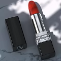 Luxury Red Lipstick with Silver Metallic Detail and Black Case Design