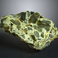 Natural Terrain Rock Formation With Green Black Yellow Surface Texture And Geological Features