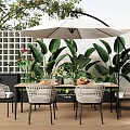 Stylish Outdoor Table With White Umbrella Wicker Chairs And Green Plants On Patio