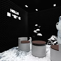 Modern Café With Black Walls White Decorative Flowers Round Tables HELLO Sign And Snowy Decor