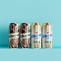 Xiaomuwu and Xiaomaiwang Beer Cans with Red Black and Golden Design on Blue Background