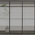 Modern Interior Featuring Glass Hinged Doors Black Frames Blinds Plants And Concrete Pots