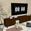 Brown TV Cabinet In Living Room With TV Teddy Bear Books Decorations Plant And Rug