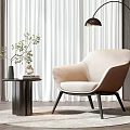 Beige Upholstered Leisure Chair With Small Round Side Table Green Plant And Floor Lamp