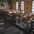 Charming Restaurant Interior With Arched Windows Wooden Tables Framed Artworks And Greenery Decor