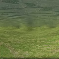 Green Rolling Terrain With Lush Grass Covered Hills And Natural Landforms