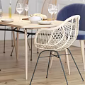 Modern Wooden Dining Table Set With Rattan Chairs Blue Cushion White Paneled Wall Pendant Lights