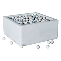 Square Minimalist Storage Boxes Filled With Small Balls In Diverse Colors